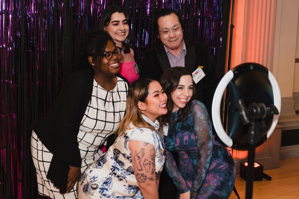 A group of students and staff posing for a photo at the gala.