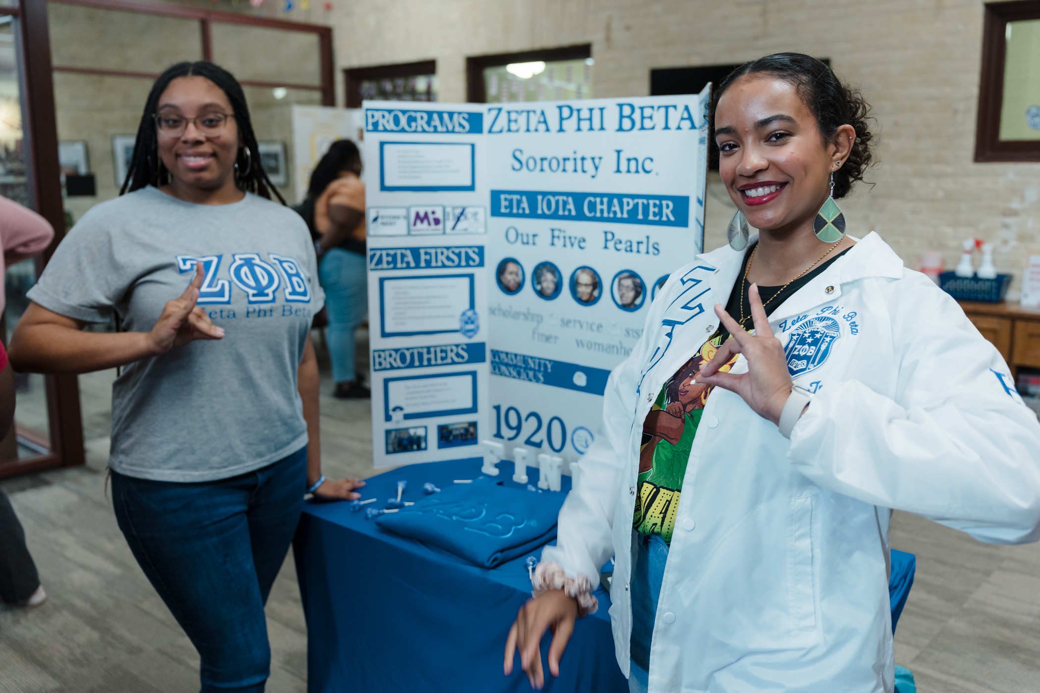 photo of two students in front of their board.